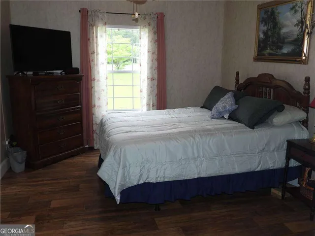 a bathroom with a sink toilet and a mirror