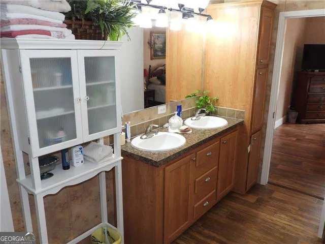 a bathroom with a toilet sink and a shower