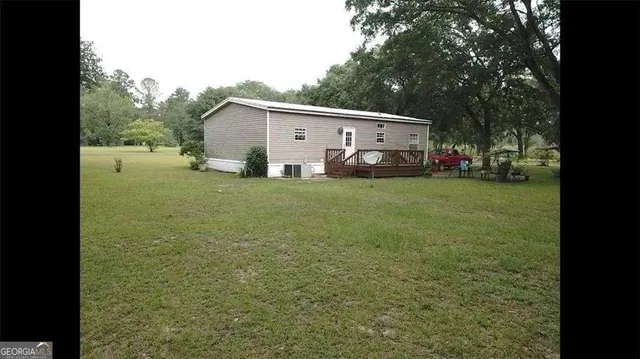 a view of a park with large trees