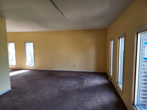 an empty room with windows