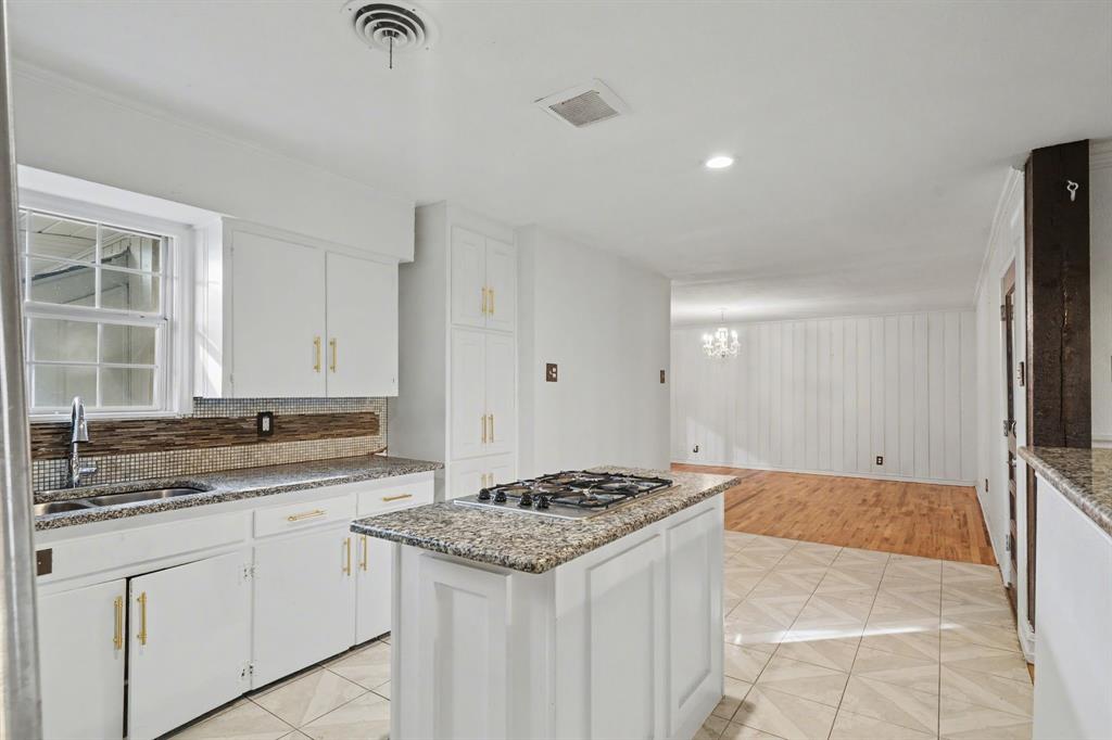 1714 East Union Bower Road Irving, TX 75061 - Photo 12 of 32 a kitchen with a stove and a sink