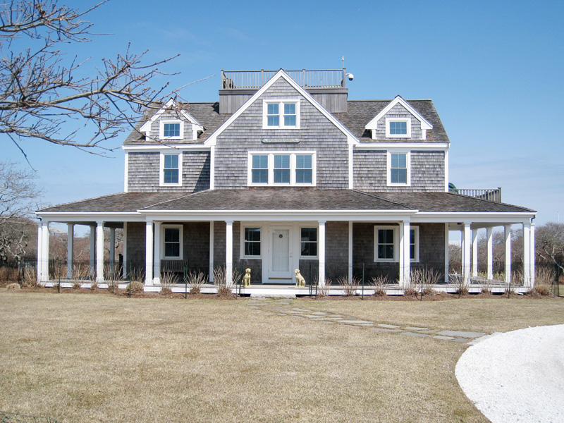 front view of a house with a street