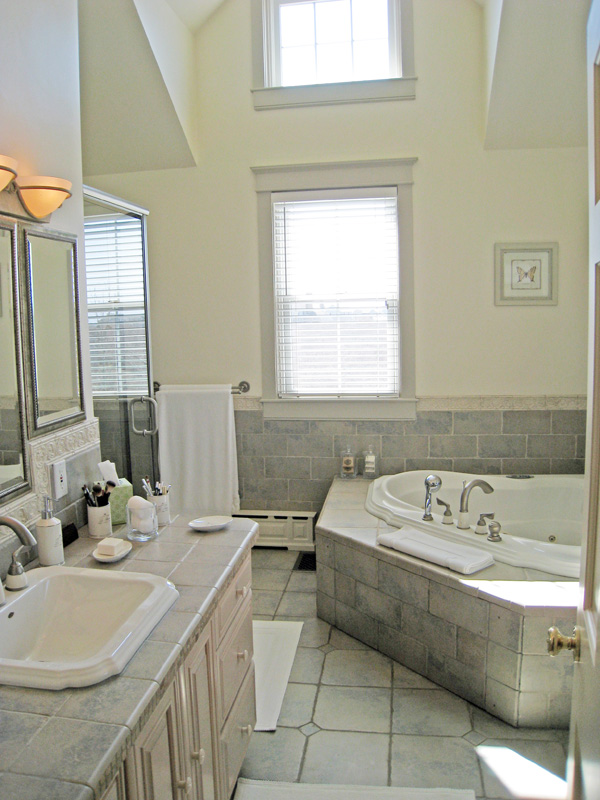 26 Old Tom Nevers Road Nantucket, MA 02554 - Photo 11 of 22 a bathroom with a granite countertop sink and a mirror