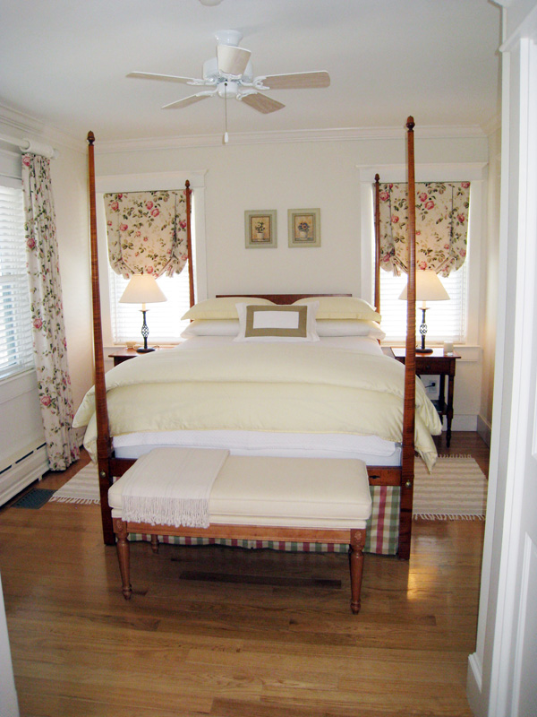 26 Old Tom Nevers Road Nantucket, MA 02554 - Photo 15 of 22 a spacious bedroom with a bed and a table in it