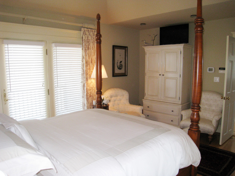 26 Old Tom Nevers Road Nantucket, MA 02554 - Photo 9 of 22 a bedroom with a bed and a large mirror