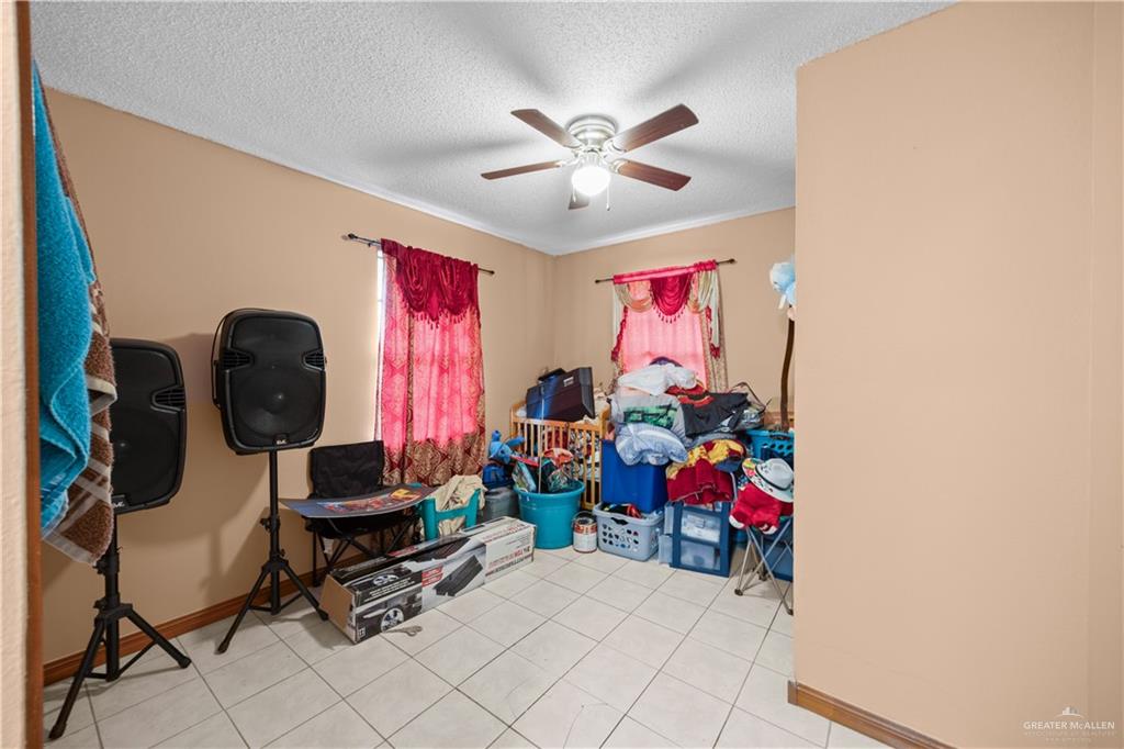 912 Rankin Street Mission, TX 78572 - Photo 15 of 17 a living room with furniture and a window