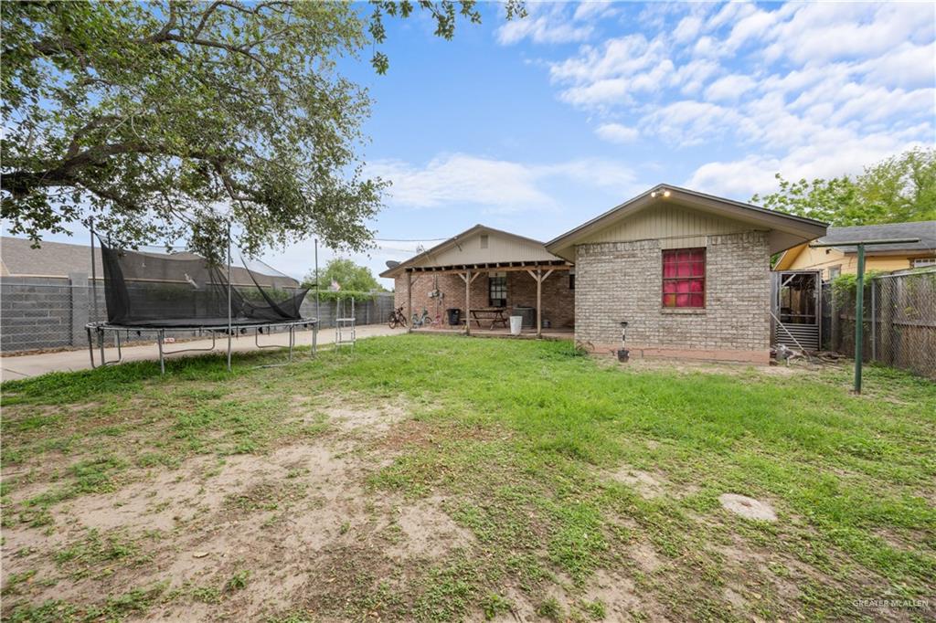 912 Rankin Street Mission, TX 78572 - Photo 16 of 17 a view of a house with a yard and sitting area