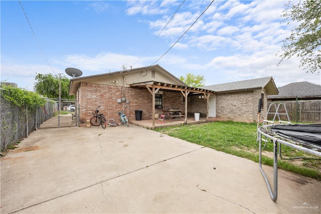 912 Rankin Street Mission, TX 78572 - Photo 17 of 17 a front view of a house with a yard and garage