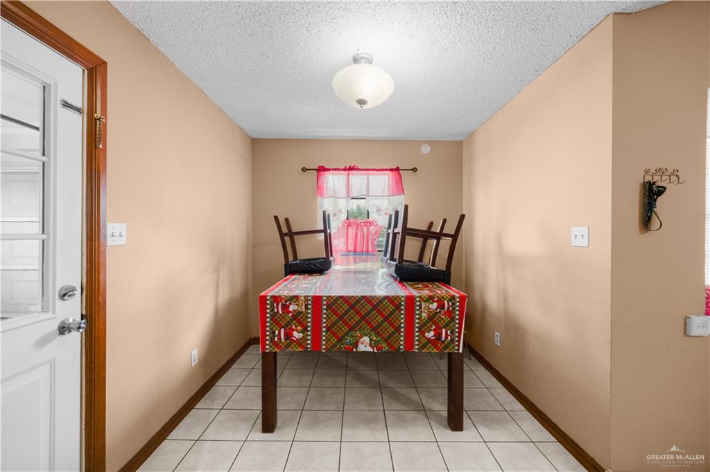 912 Rankin Street Mission, TX 78572 - Photo 6 of 17 a view of a livingroom with furniture and chandelier fan
