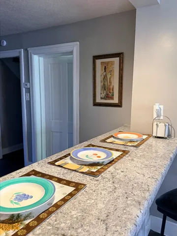 a bedroom with a bed and a mirror