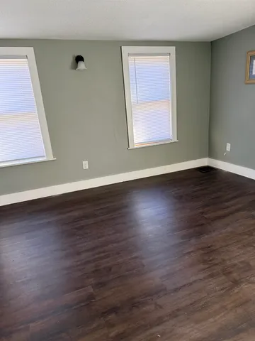a view of room with window and stairs
