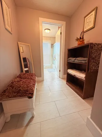 a living room with a couch and a stove top oven