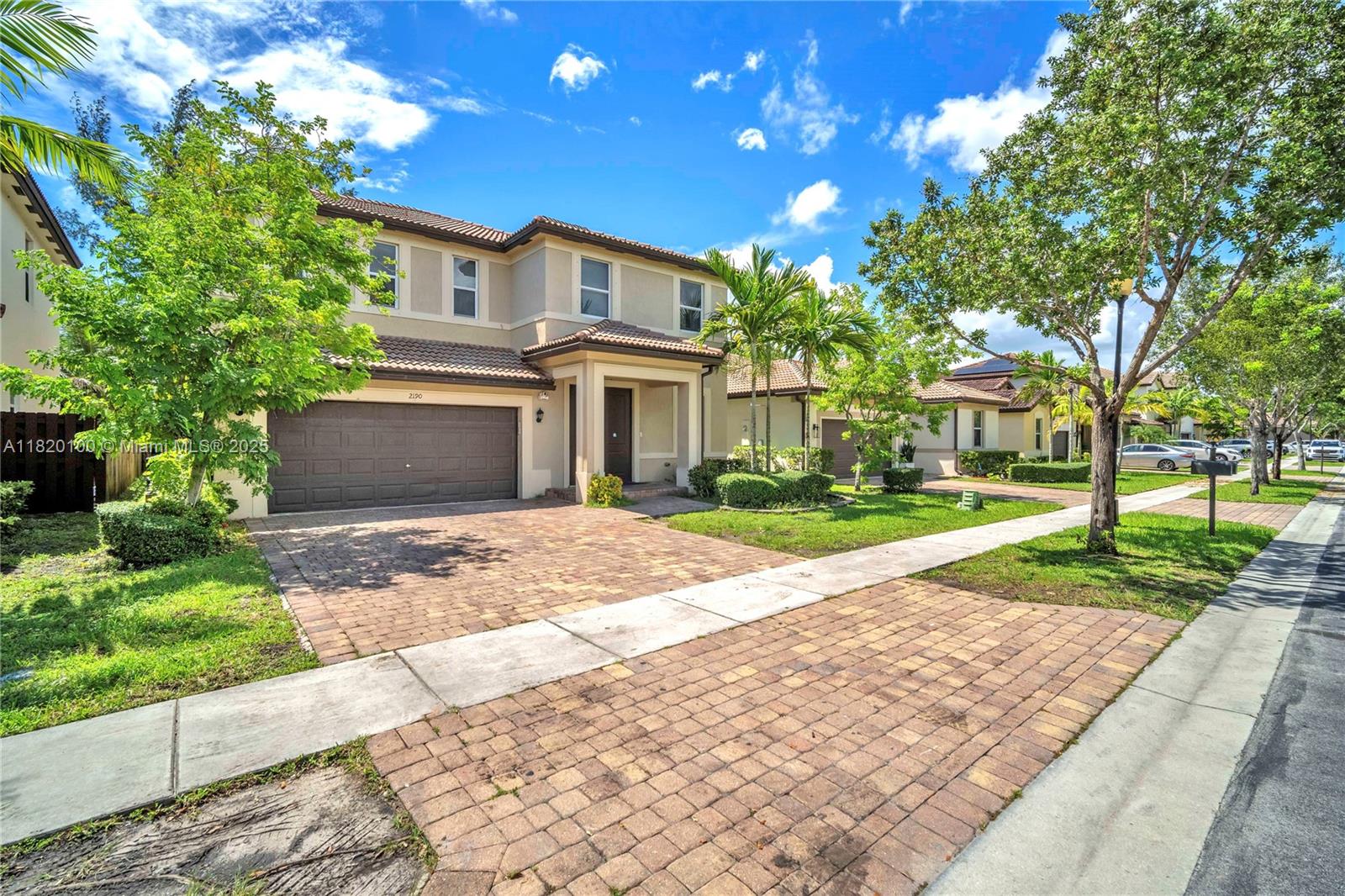 2190 Southeast 2nd Street Homestead, FL 33033 - Photo 1 of 37 a front view of a house with a yard and a garden