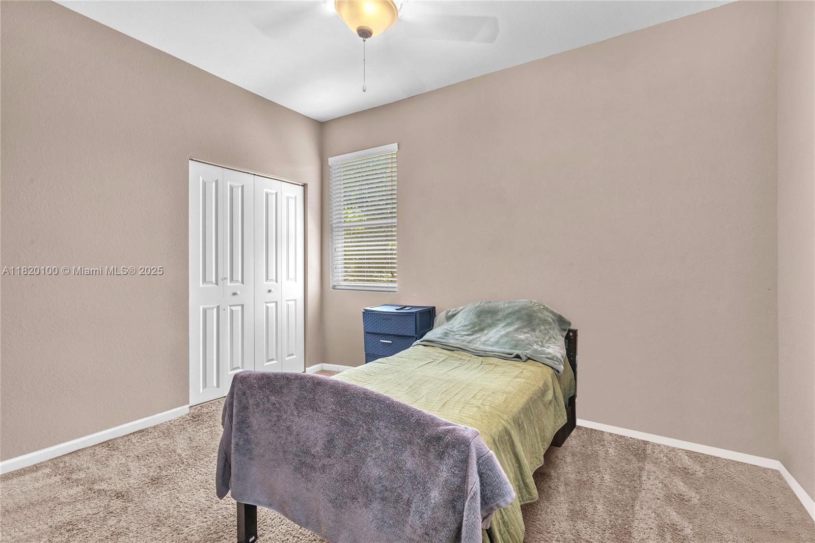 2190 Southeast 2nd Street Homestead, FL 33033 - Photo 19 of 37 a bedroom with a bed and a window