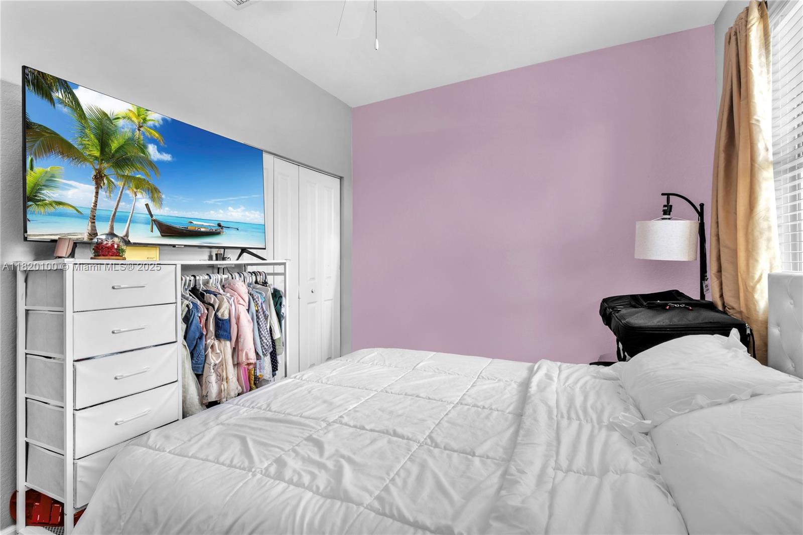 2190 Southeast 2nd Street Homestead, FL 33033 - Photo 24 of 37 a bedroom with a bed and a flat screen tv