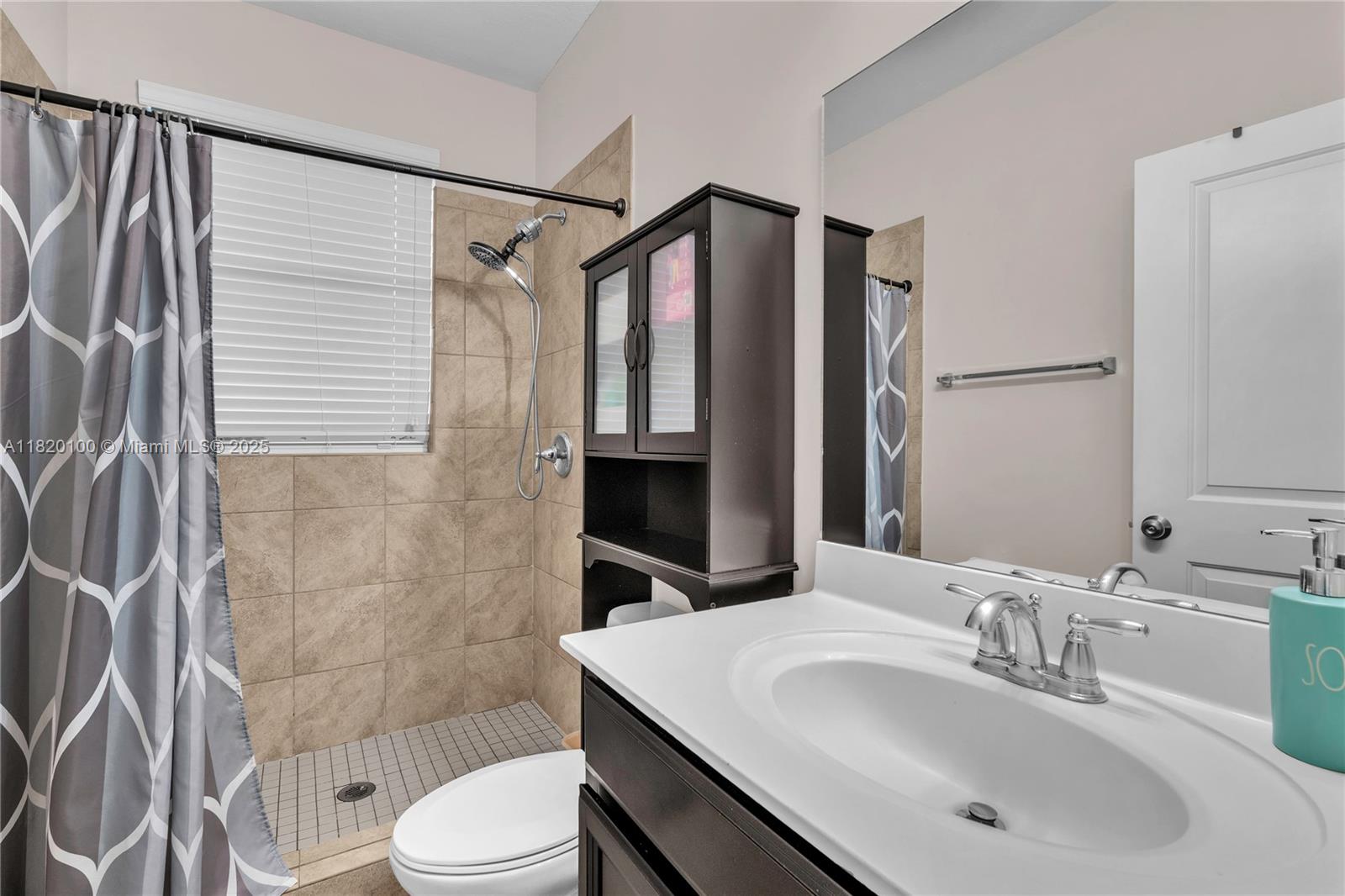 2190 Southeast 2nd Street Homestead, FL 33033 - Photo 26 of 37 a bathroom with a sink toilet and shower