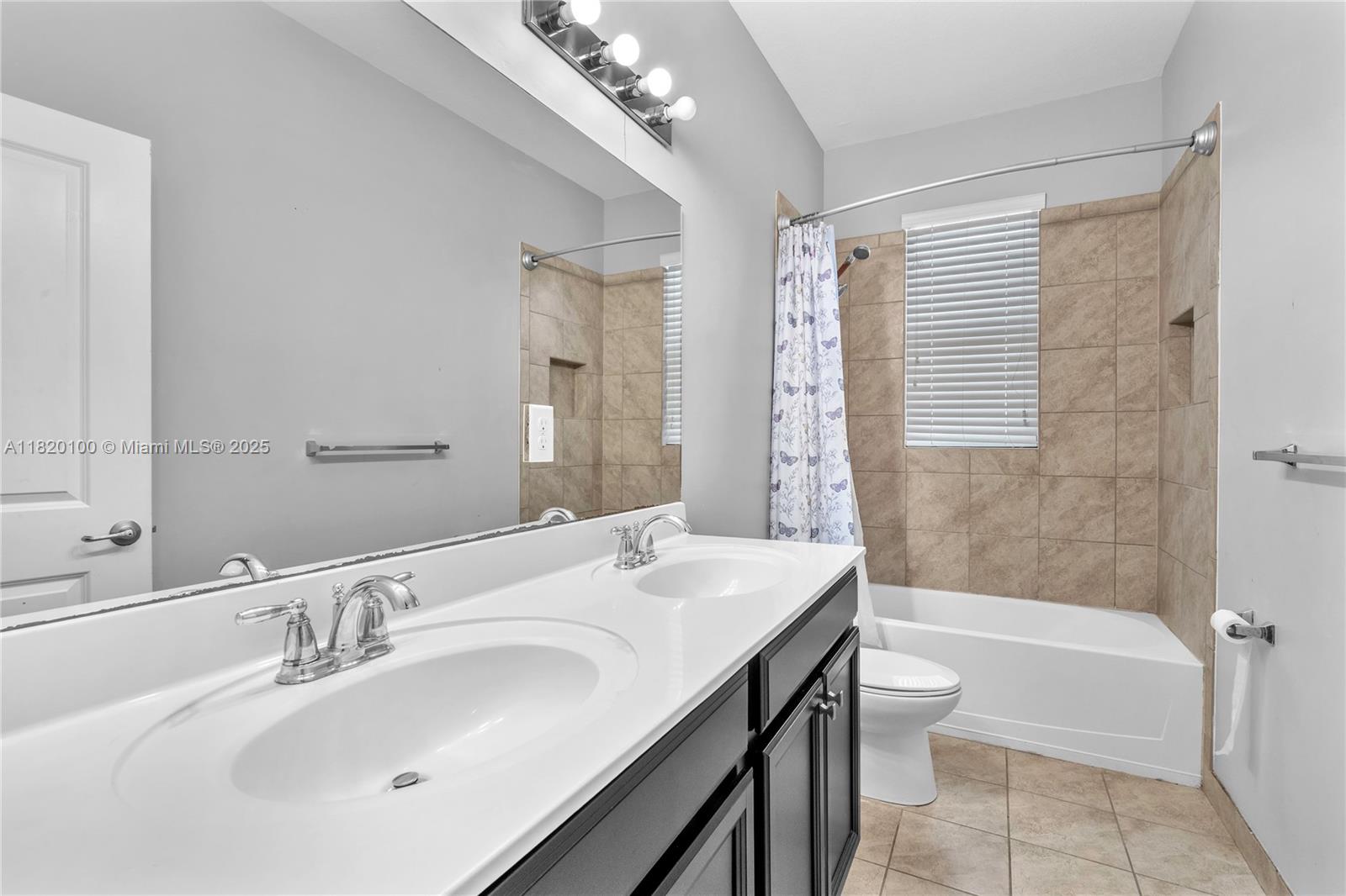 2190 Southeast 2nd Street Homestead, FL 33033 - Photo 28 of 37 a bathroom with a tub a sink and mirror