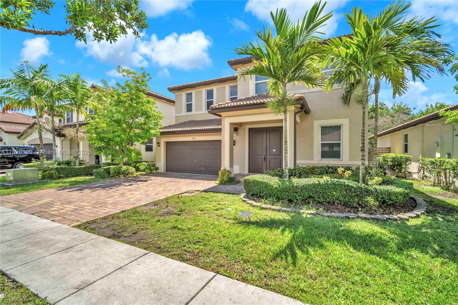 2190 Southeast 2nd Street Homestead, FL 33033 - Photo 3 of 37 a front view of a house with a garden