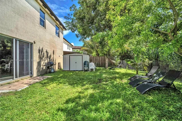 a backyard of a house with seating space