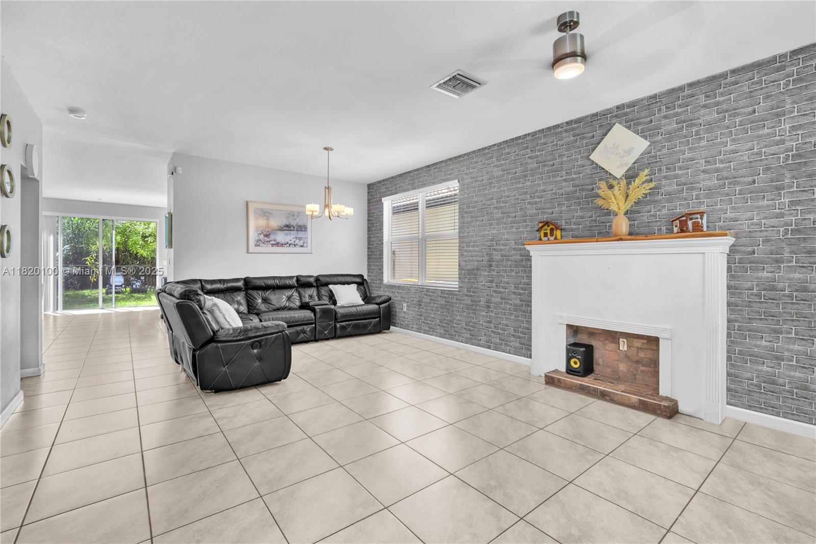 2190 Southeast 2nd Street Homestead, FL 33033 - Photo 6 of 37 a living room with furniture and a fireplace