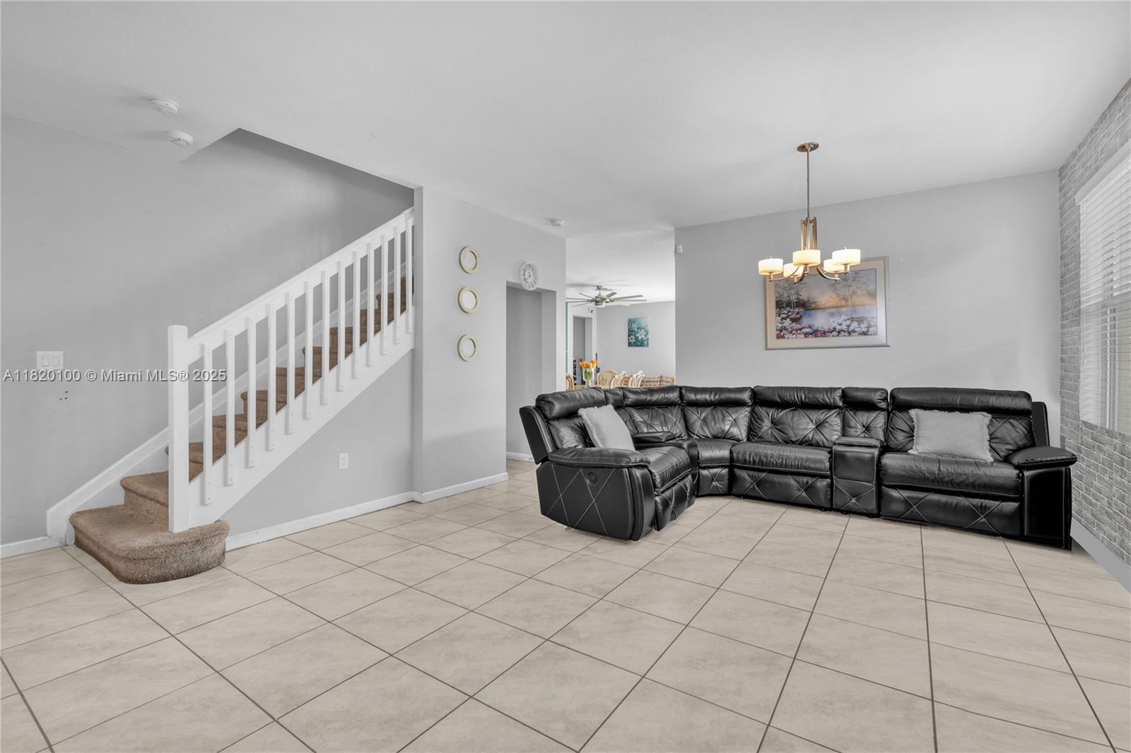 2190 Southeast 2nd Street Homestead, FL 33033 - Photo 8 of 37 a living room with couches and dining table with wooden floor
