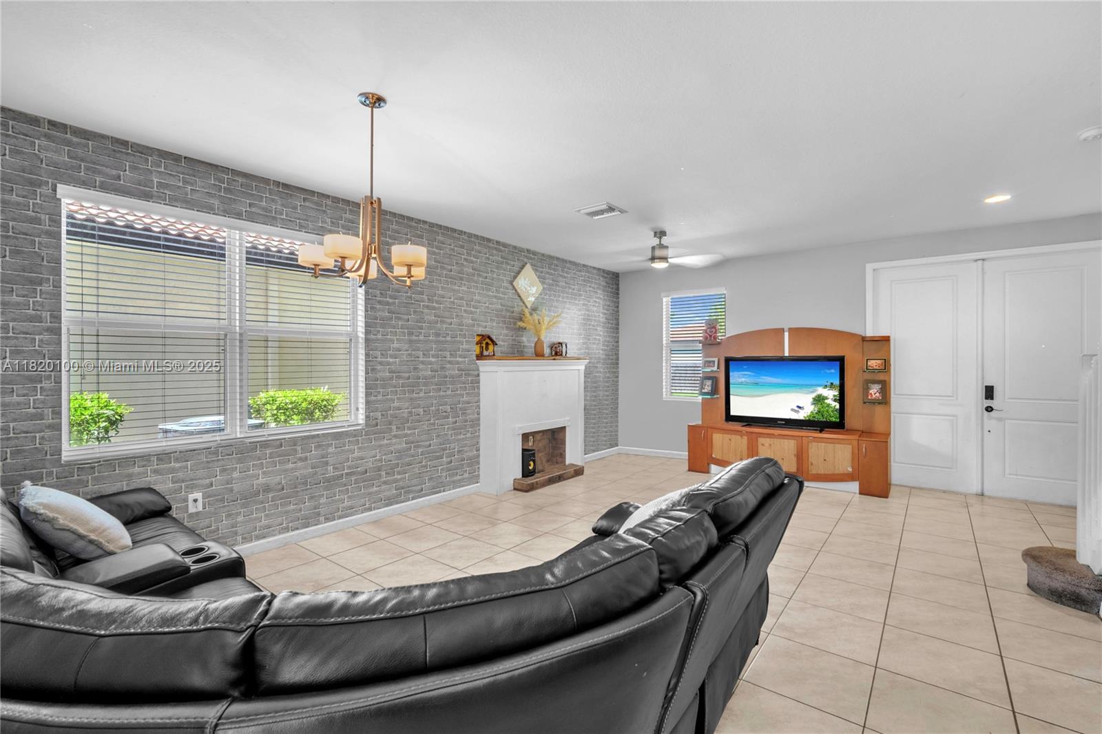 2190 Southeast 2nd Street Homestead, FL 33033 - Photo 9 of 37 a living room with furniture and a flat screen tv