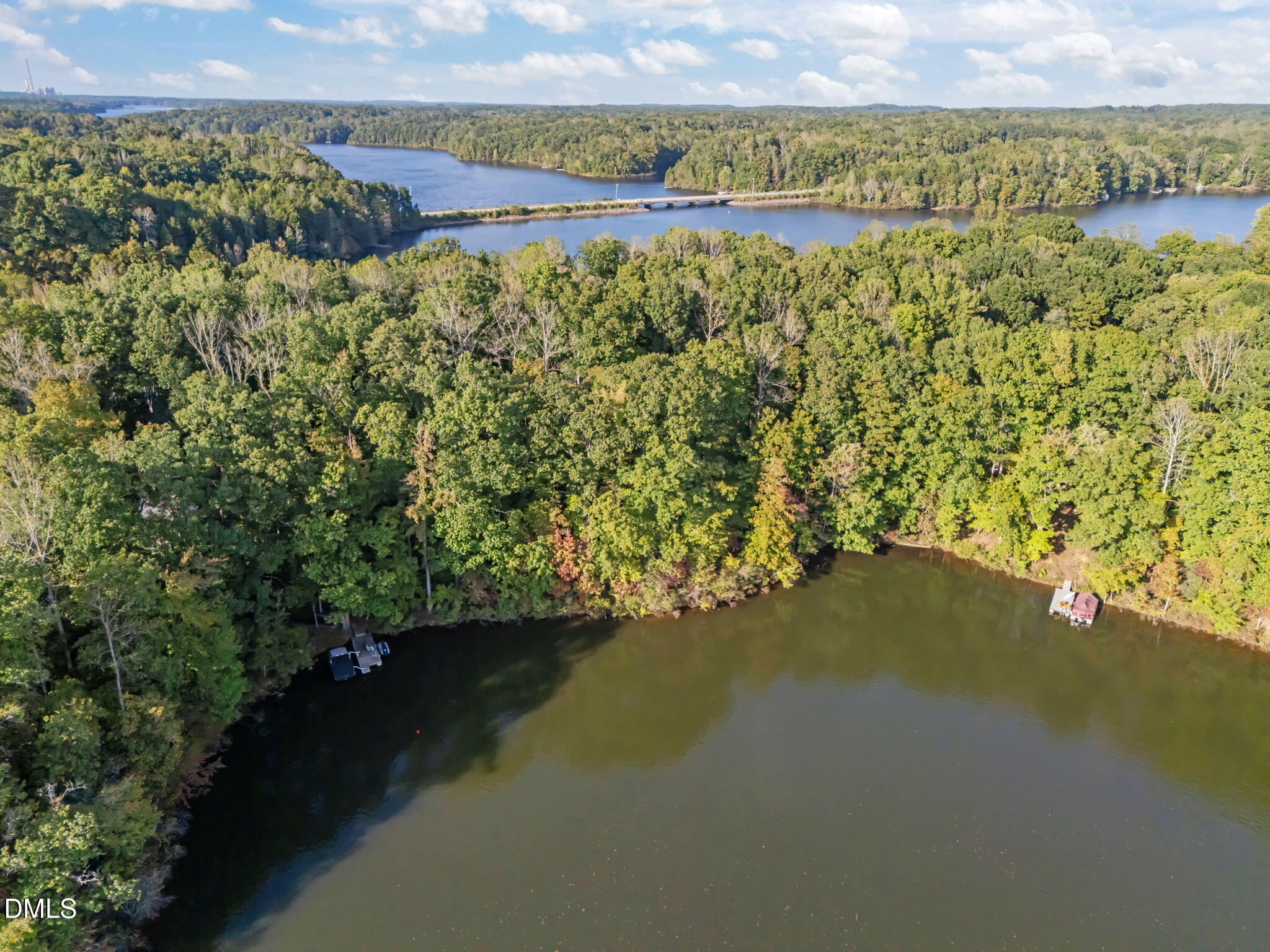 641 Fishermans Point Road Roxboro, NC 27574 - Photo 4 of 12 a view of a lake with a mountain in the background
