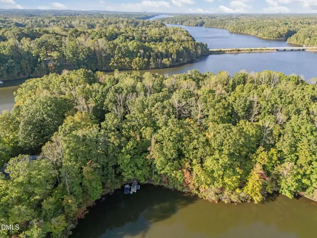 an aerial view of a house with a lake view