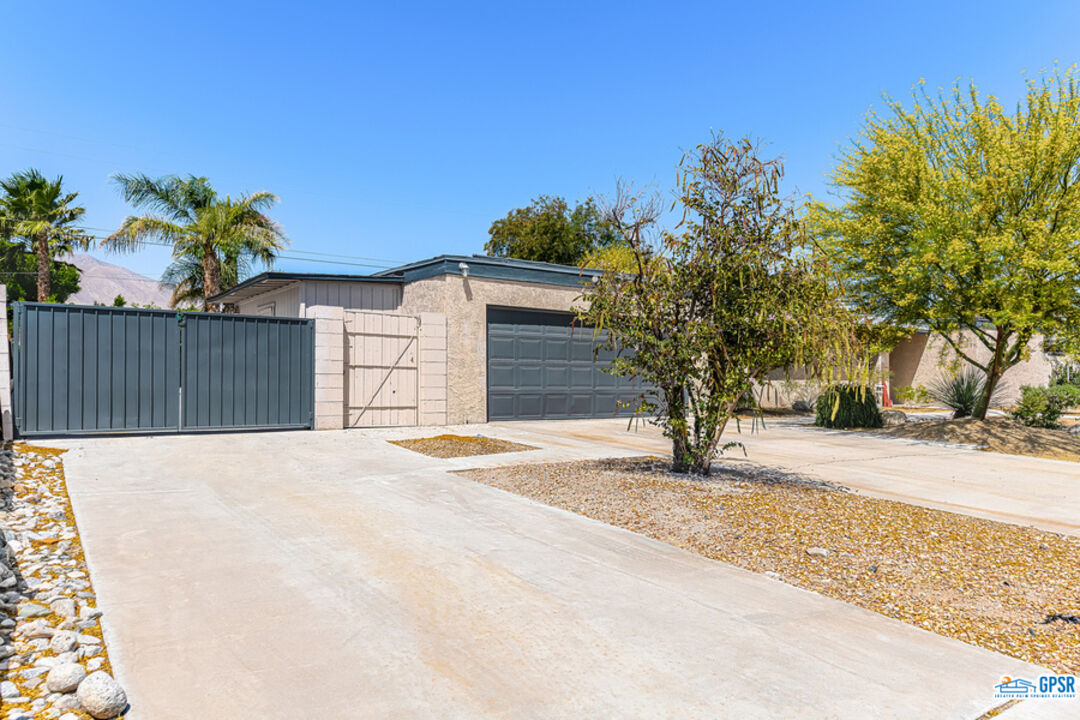 2783 North Cerritos Road Palm Springs, CA 92262 - Photo 11 of 25 a front view of a house with a yard and garage