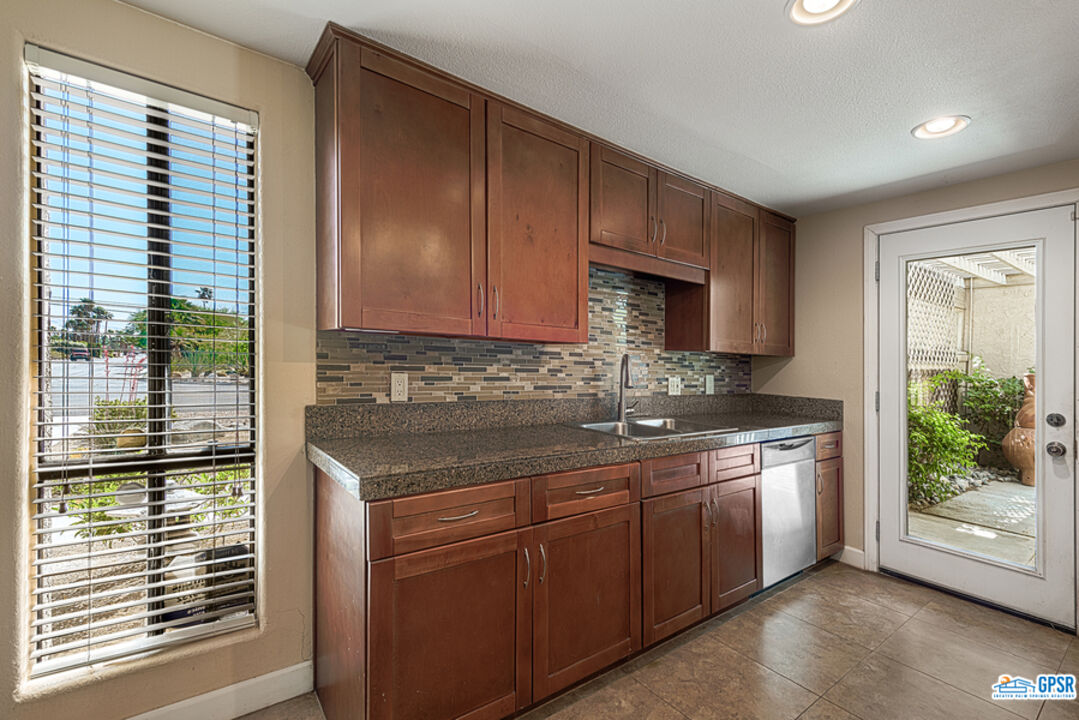 2783 North Cerritos Road Palm Springs, CA 92262 - Photo 15 of 25 a kitchen with a sink and cabinets