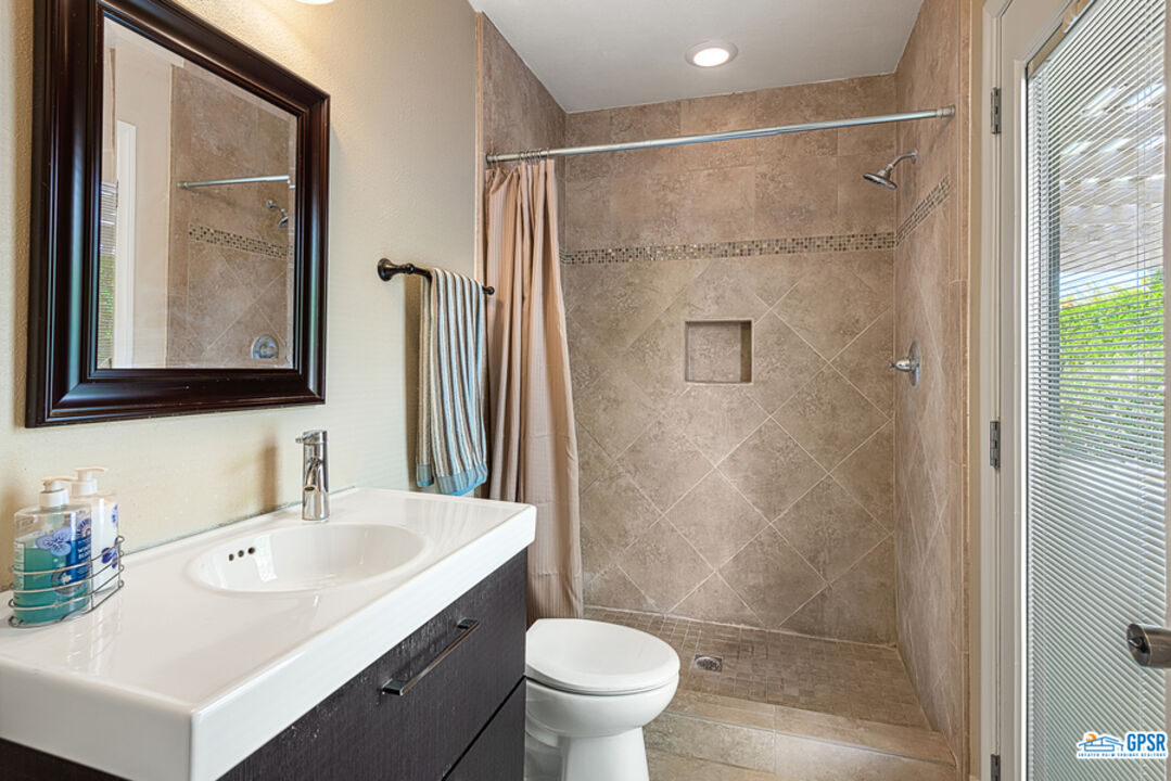2783 North Cerritos Road Palm Springs, CA 92262 - Photo 20 of 25 a bathroom with a sink toilet and shower