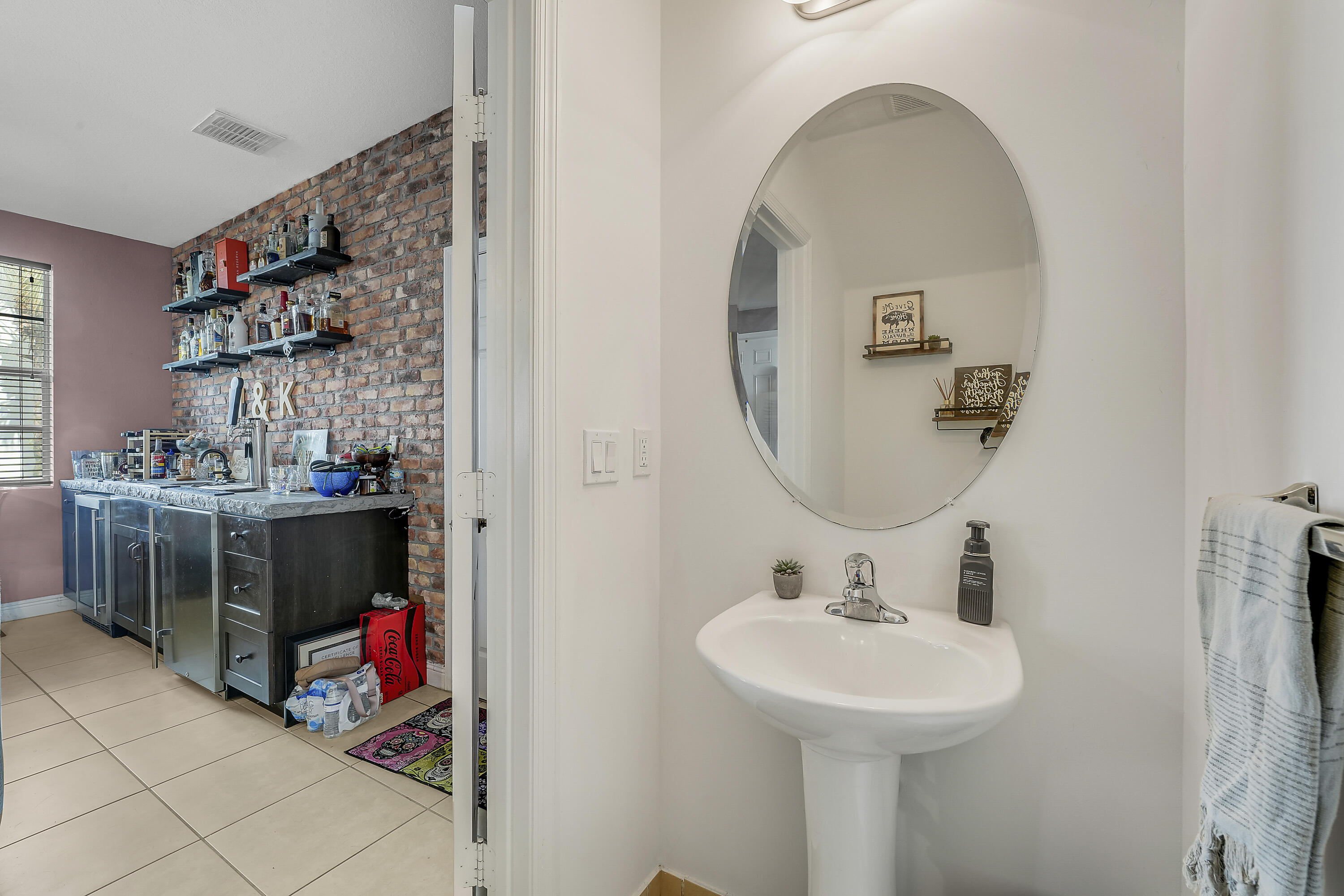 2900 Southwest 119th Way Miramar, FL 33025 - Photo 20 of 37 a bathroom with a sink and a mirror