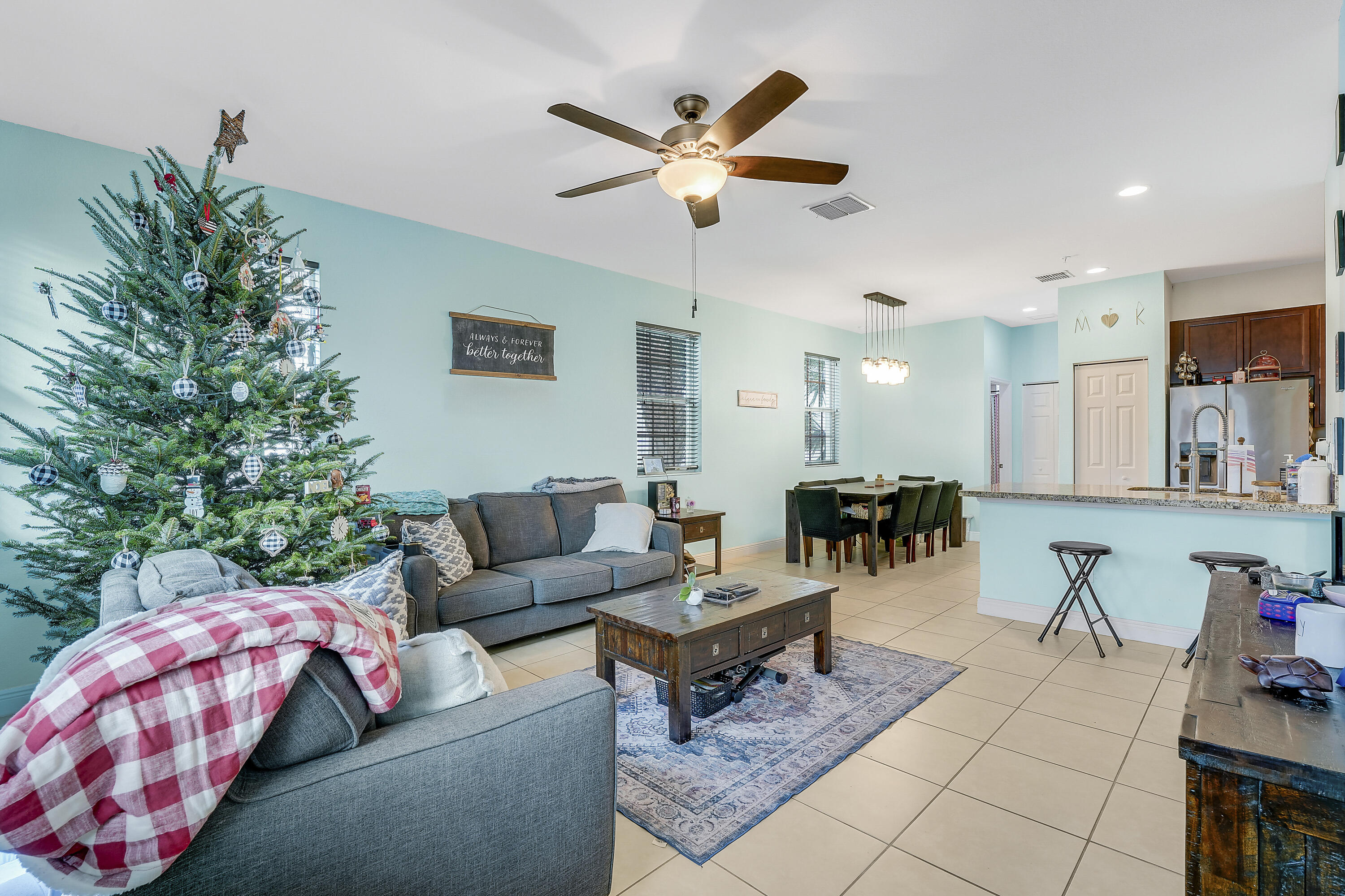 2900 Southwest 119th Way Miramar, FL 33025 - Photo 22 of 37 a living room with furniture and a chandelier