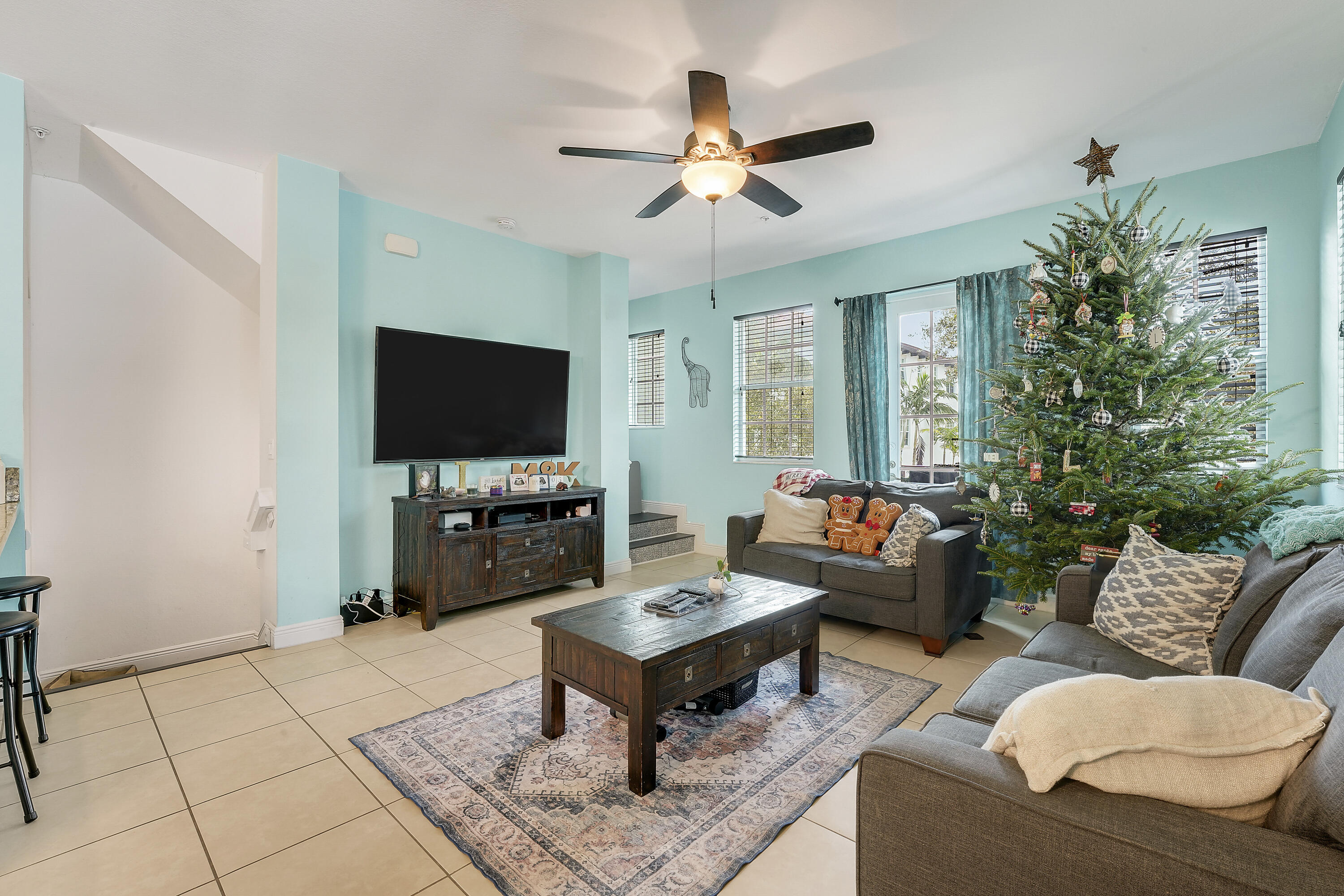 2900 Southwest 119th Way Miramar, FL 33025 - Photo 23 of 37 a living room with furniture and a flat screen tv