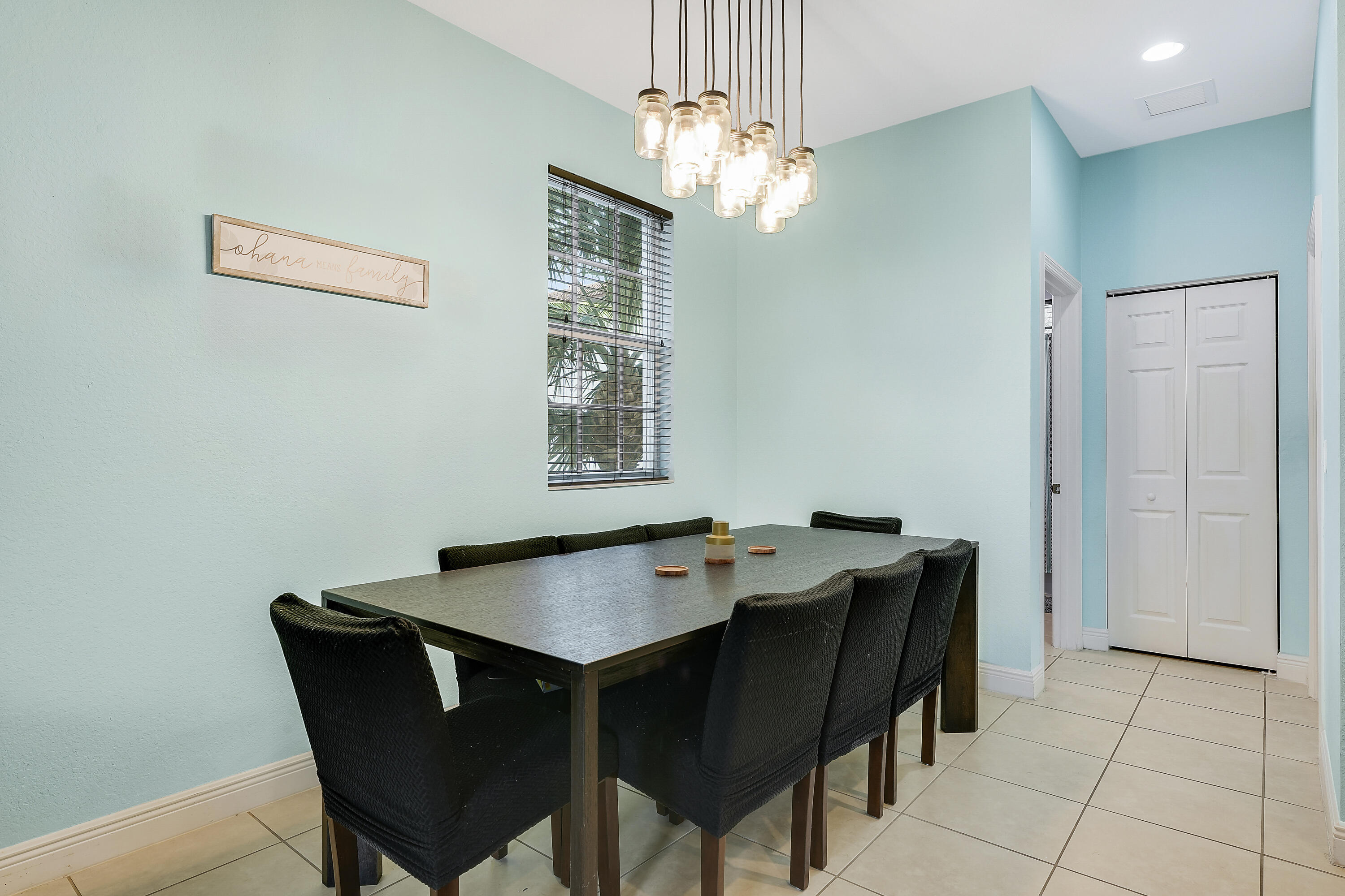 2900 Southwest 119th Way Miramar, FL 33025 - Photo 24 of 37 a dining room with a table and chairs