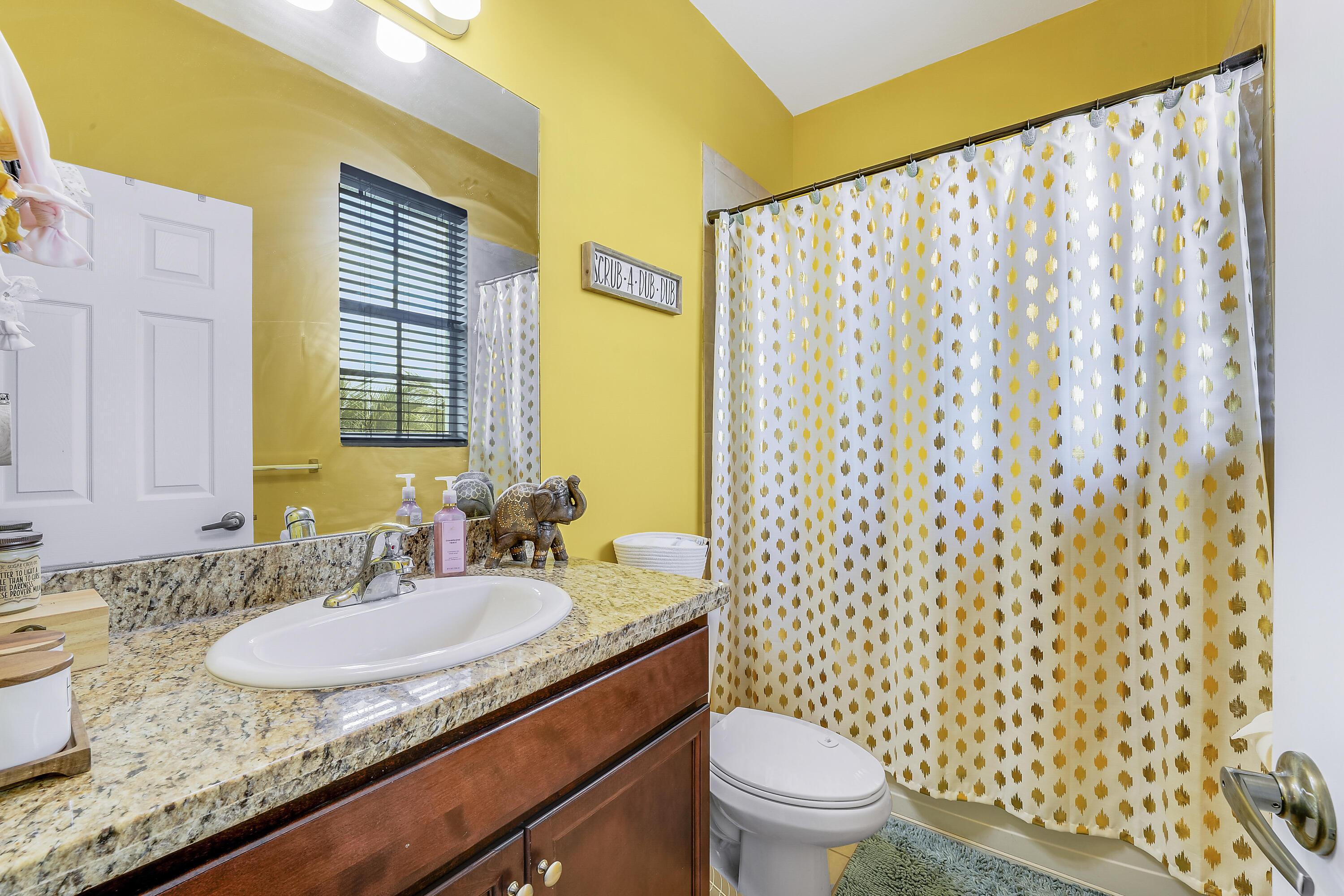 2900 Southwest 119th Way Miramar, FL 33025 - Photo 31 of 37 a bathroom with a granite countertop sink and a mirror
