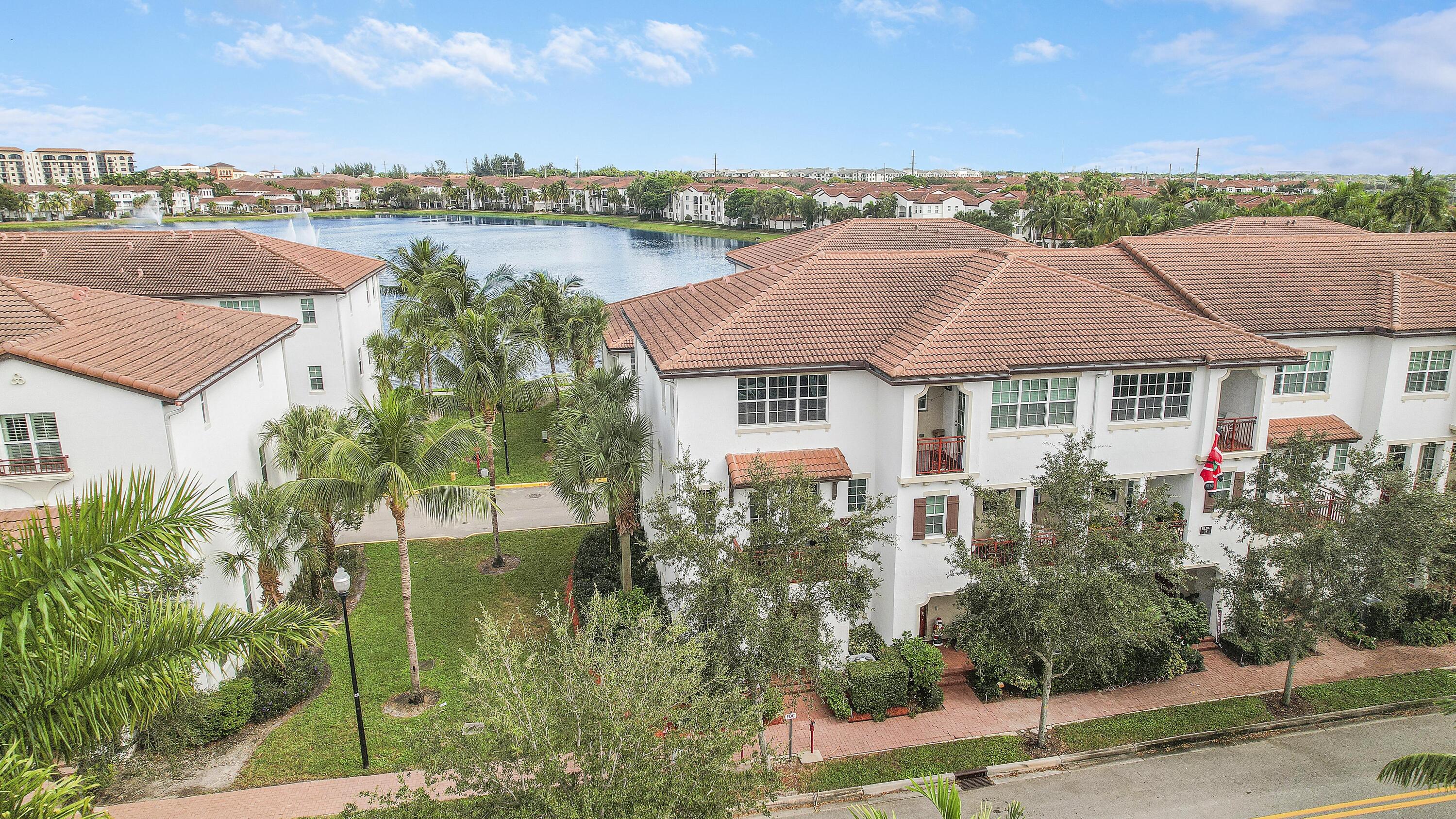 2900 Southwest 119th Way Miramar, FL 33025 - Photo 4 of 37 a aerial view of a house with a garden and lake view
