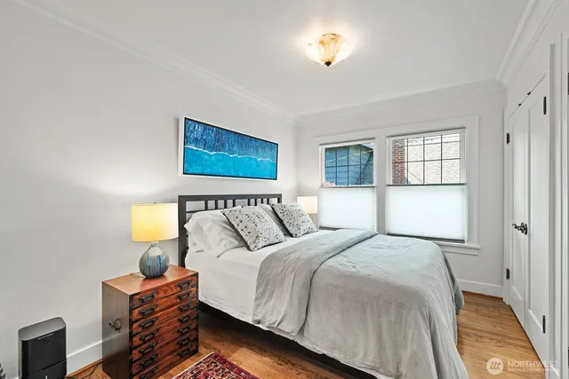 a bedroom with a bed and window