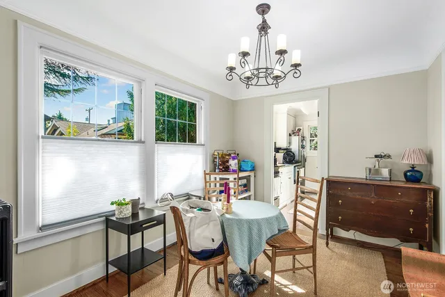 a view of a dining room with furniture window and outside view