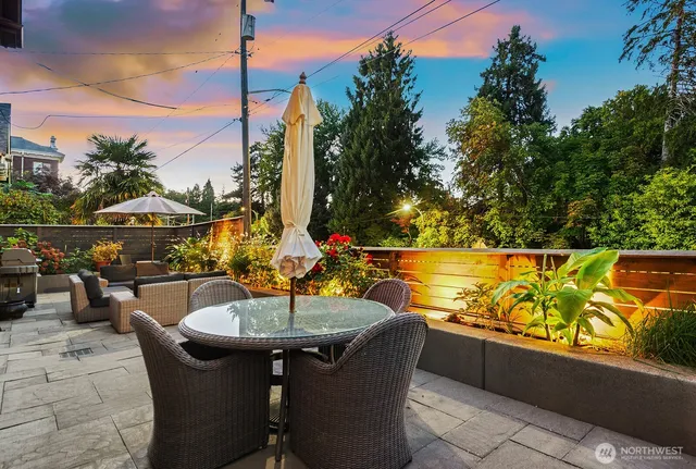 a view of swimming pool with outdoor seating and city view
