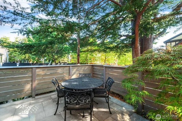 a view of balcony with wooden floor and outdoor seating