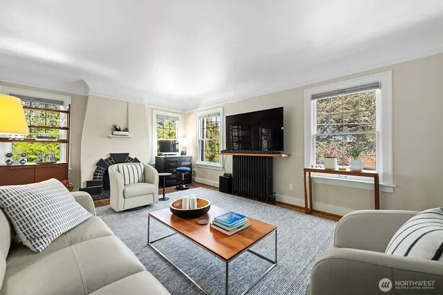 a living room with furniture window and a table