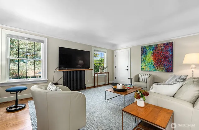 a living room with furniture and a flat screen tv