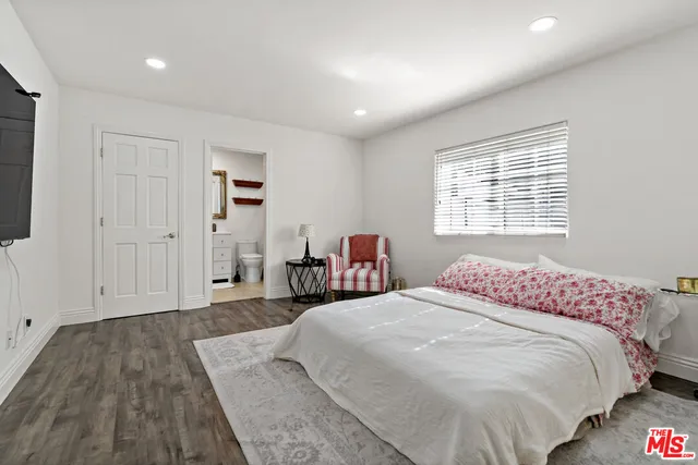 a bathroom with a granite countertop toilet sink and shower