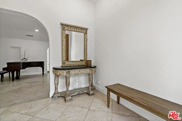 a room with view of a mirror and chair