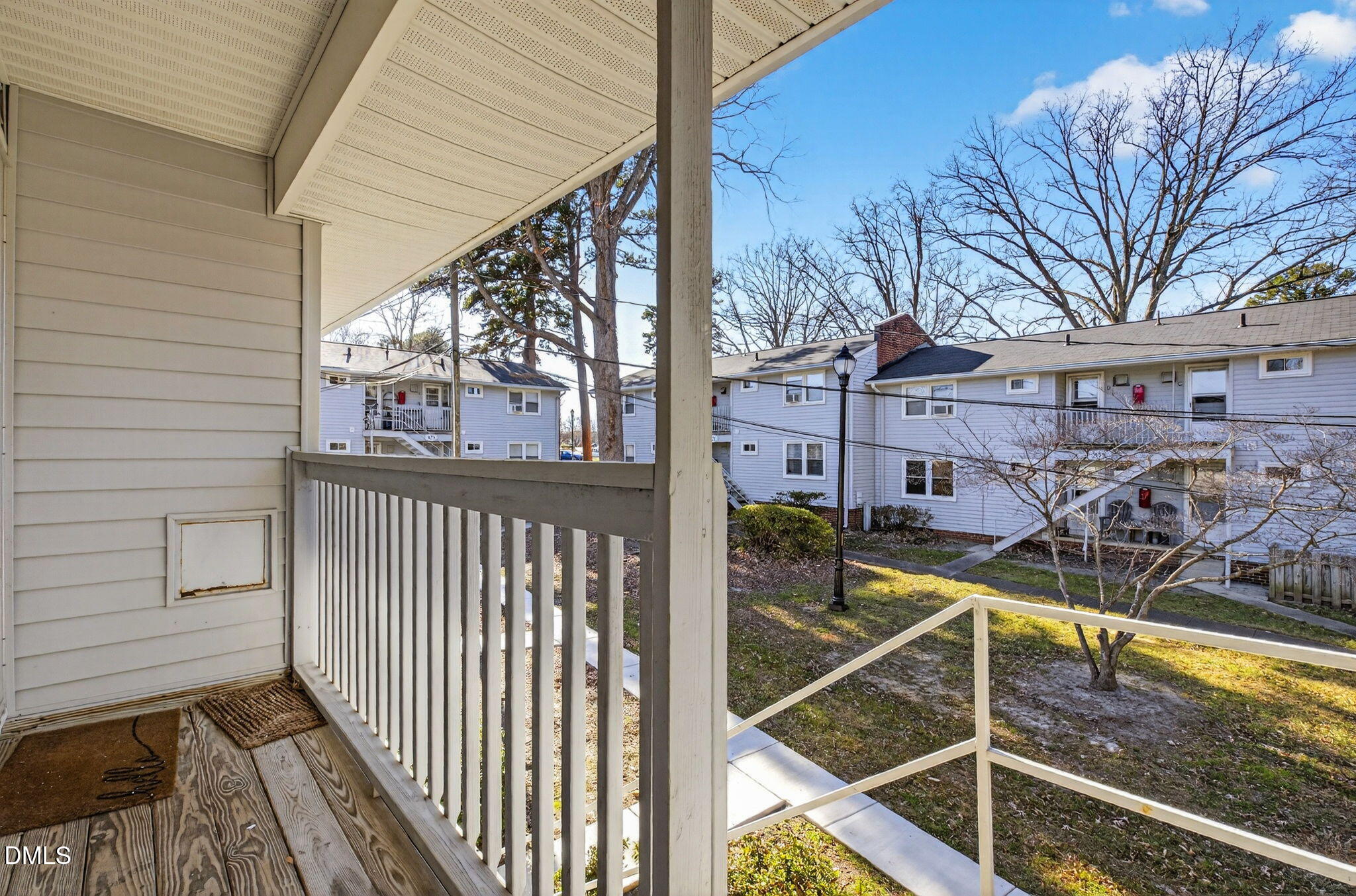 827 Daniels Street, Unit D Raleigh, NC 27605 - Photo 14 of 15 a view of a balcony with chairs