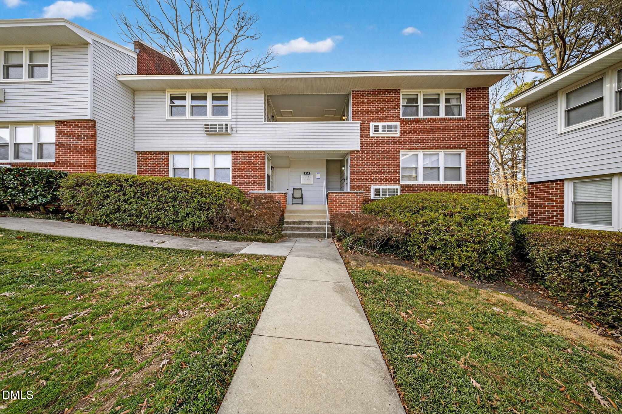 827 Daniels Street, Unit D Raleigh, NC 27605 - Photo 2 of 15 a front view of a house with a yard