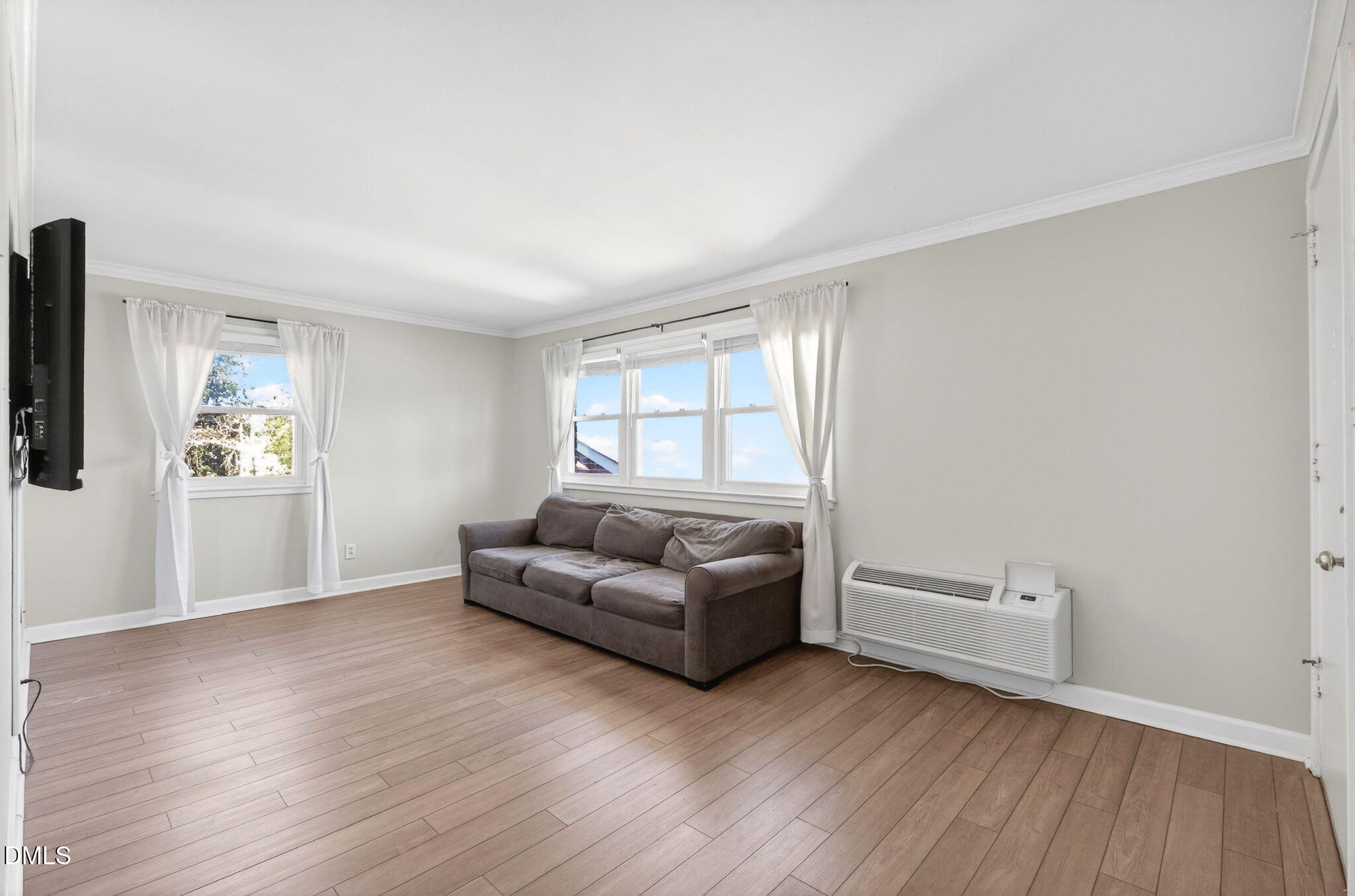 827 Daniels Street, Unit D Raleigh, NC 27605 - Photo 6 of 15 a living room with furniture and a window