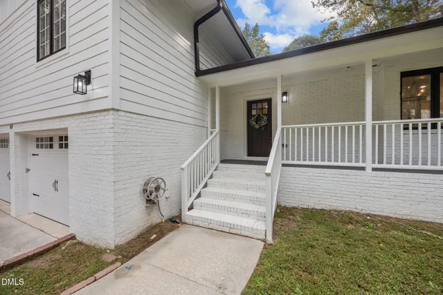 a view of a porch and garden