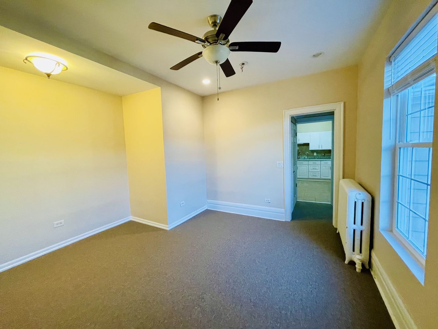 72 North 4th Street, Unit 4 Aurora, IL 60505 - Photo 7 of 11 a view of an empty room with a window